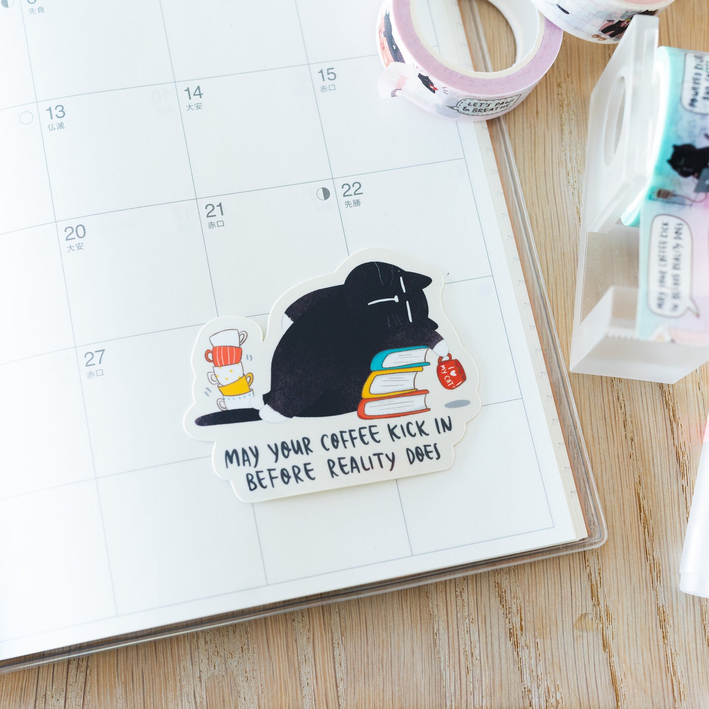 "May your coffee kick in before reality does" Funny coffee quote Mocha cat sticker